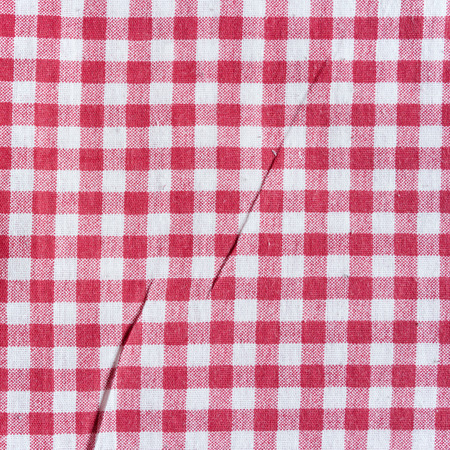 Red and white vintage texture. Red linen checkered tablecloth background.の写真素材