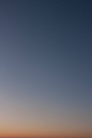 Evening sky without clouds. Clear sky as background or gradient.の写真素材