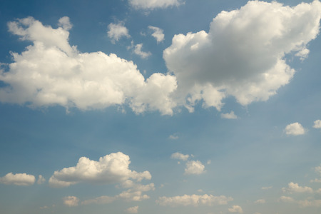 Vintage sky with white clouds. Blue sky. Sky vintage background with the fluffy white clouds.の写真素材