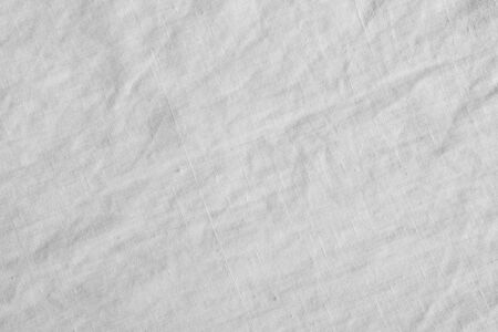 White canvas with delicate striped pattern. Fabric texture.の写真素材