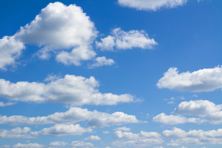 Blue sky, big and small clouds. Beautiful cloudscape over horizon. Heaven.