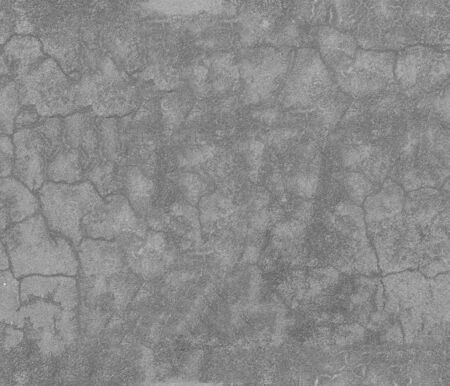 Seamless gray concrete background. Old asphalt, bitumen texture with cracks, tiled.の写真素材
