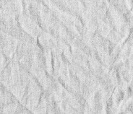 Fabric texture. White canvas with delicate striped pattern, crumpled.の写真素材