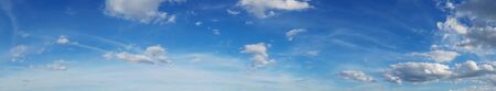 Beautiful sky panorama, cloudscape over horizon. Blue sky and clouds, heaven.の写真素材