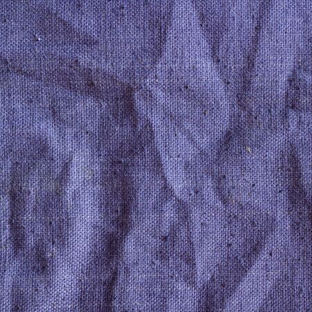 Blue sackcloth, jeans vintage canvas with delicate striped pattern, crumpled. Fabric texture.の写真素材