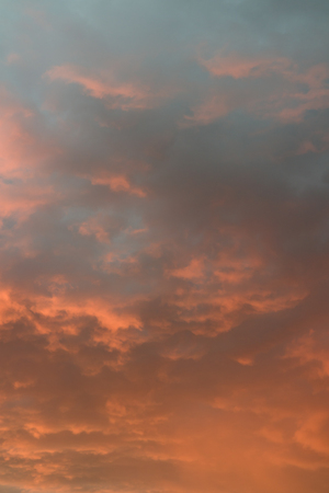 Dramatic cloud on evening sky. Sunset over ocean. Fire in the sky.の写真素材