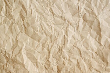 Old aged parchment texture. Beige crumpled paper sheet as background.の写真素材
