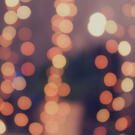 Beautiful light from garland on the window. Holiday light, beautiful shiny sparkles.の写真素材
