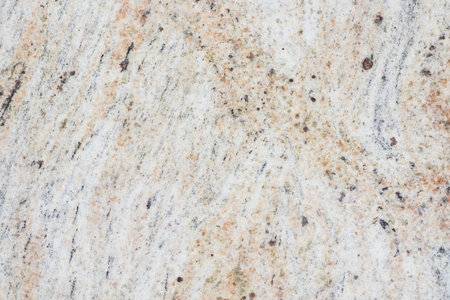Beige granite texture with natural pattern. Granite stone wall background.