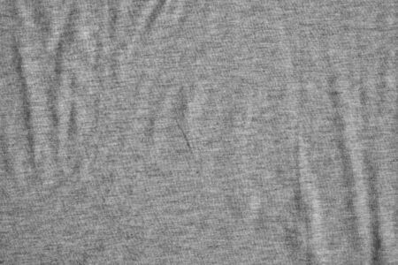 Waves on gray crumpled fabric background. Canvas with delicate striped pattern.の写真素材