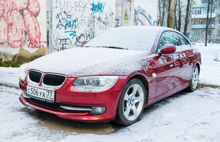 Smolensk, Russia - December 12, 2016: New luxury BMW 6 Series parked in winter street near wall with graffiti.のeditorial素材