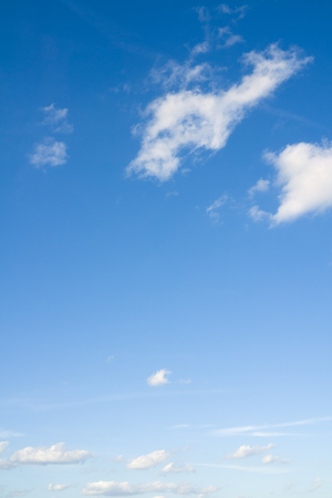 White clouds in blue sky. Beautiful coudscape over horizon.の写真素材