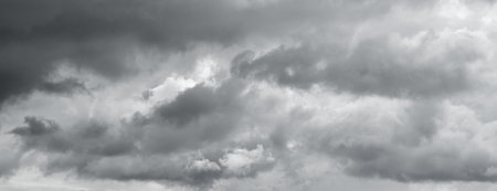 Panorama of a gray gloomy sky. Thunderclouds over horizon, cloudscape, storm.