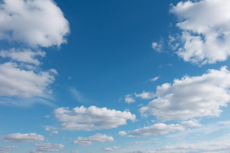 Sky with flying clouds over horizon, heaven. White clouds against blue sky.の写真素材