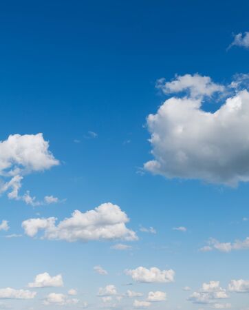 Beautiful blue sky with clouds over horizon. Clouds flying against blue sky at sunny day.の写真素材