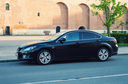 Smolensk, Russia - June 08, 2017: New black Mazda 6 (Atenza) parked on the street of ancient old russian town Smolensk. The Mazda6 has sold over one million units worldwide since its introduction, hitting this sales milestone faster than all previous Mazdのeditorial素材