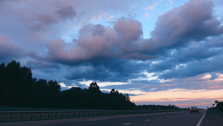 Highway road at evening. View on highway, speed concept.の写真素材