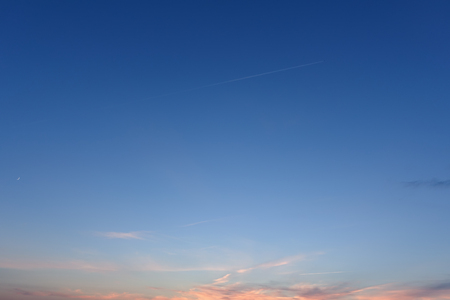 Beautiful morning sky. Sky and small clouds, new moon.の写真素材