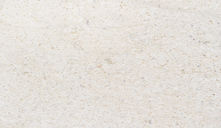 Detailed marble stone. Fragment of limestone wall, stone block background.の写真素材