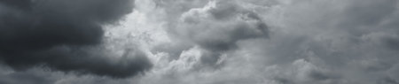 Panorama of beautiful grey thunder clouds. Clouds over horizon.