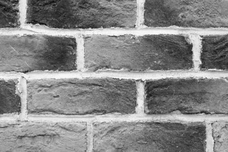 Hand made black and white detail brick wall close-up, loft.の写真素材