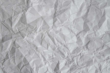 Gray background. Crumpled paper sheet background.の写真素材