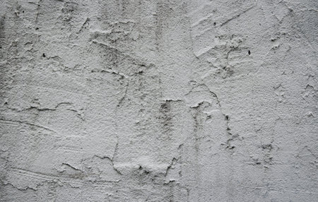 Detailed fragment of new cement wall with plaster, gray background, texture.