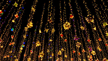 New years decorations, colorful garlands in night skyの写真素材
