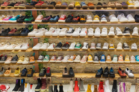 Berlin, Germany - March 13, 2022: colorful boots in shop, variety of summer and spring shoes in a storeのeditorial素材