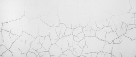 Cracked gray wall abstract background. Photo of a painted concrete wall with craksの写真素材