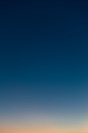 Vertical photo of a beautiful clear evening sky without clouds