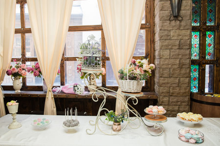 table decorated with sweets and flowers