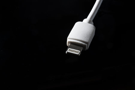White Charging Wire on Black Background