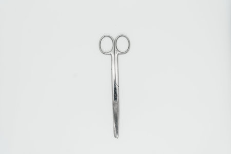 Scissors on a white background close-up. View from above