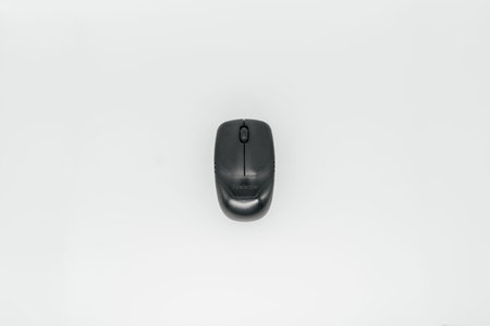 Old computer mouse on a white background close-up. View from aboveの写真素材