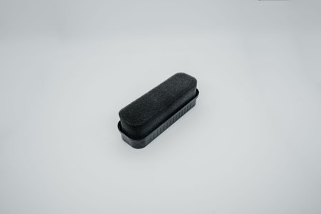 Shoe Polish sponge on a light background close up. Side view