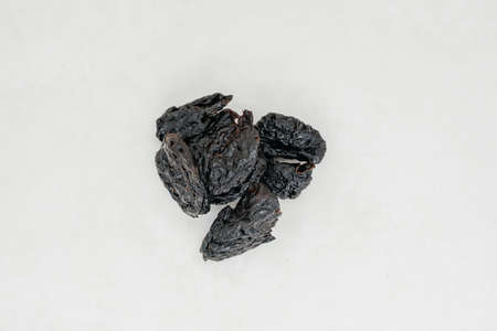 Prunes on a white background close-up. View from aboveの写真素材