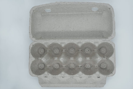 Box of eggs on a light background. View from above