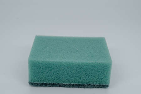Sponge for washing dishes on a light background close-up. Side viewの写真素材