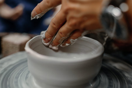 Modeling clay on a potter's wheelの写真素材