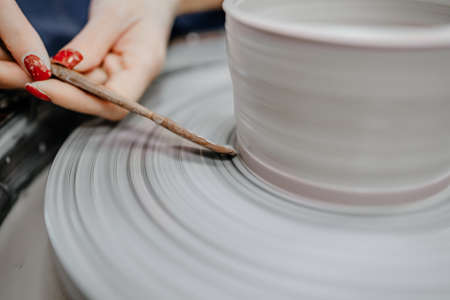 Modeling clay on a potter's wheelの写真素材
