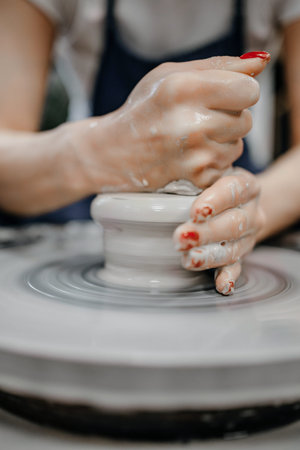 Modeling clay on a potter's wheel