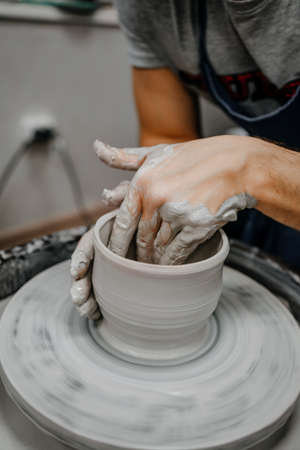 Modeling clay on a potter's wheelの写真素材