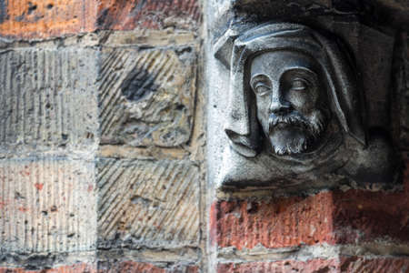 Decorative man head in Brugge, Belgiumの写真素材