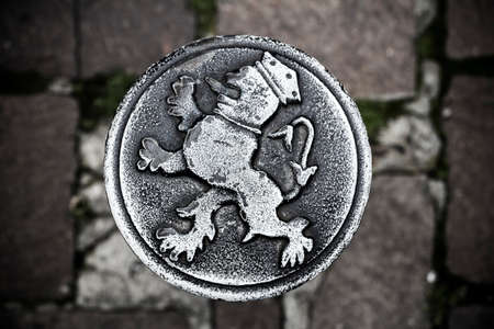 Round steel medallion (roundel) in pavement, Ghent, Belgiumの写真素材