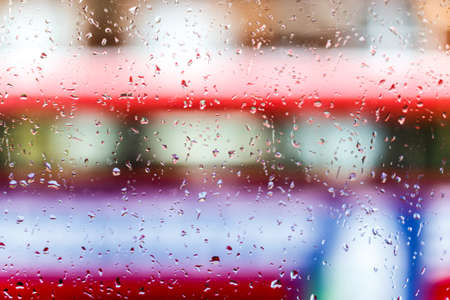 Raindrops on double decker bus, Londonの写真素材