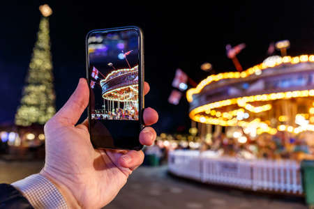 Taking photo of Christmas fair in Hyde park in 2016, Londonの写真素材