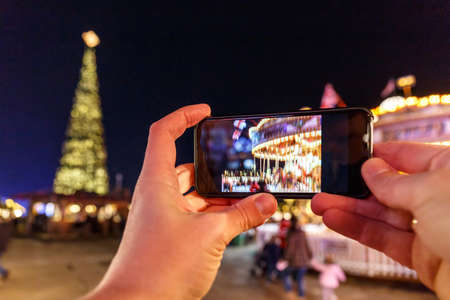 Taking photo of Christmas fair in Hyde park in 2016, Londonの写真素材