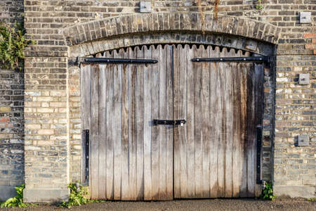 Vintage padlock on wooden gate, Englandの写真素材