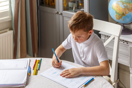 Boy doing his homework and studying